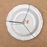 Hollow plate in Moustiers faience decorated with a bird, 19th century.