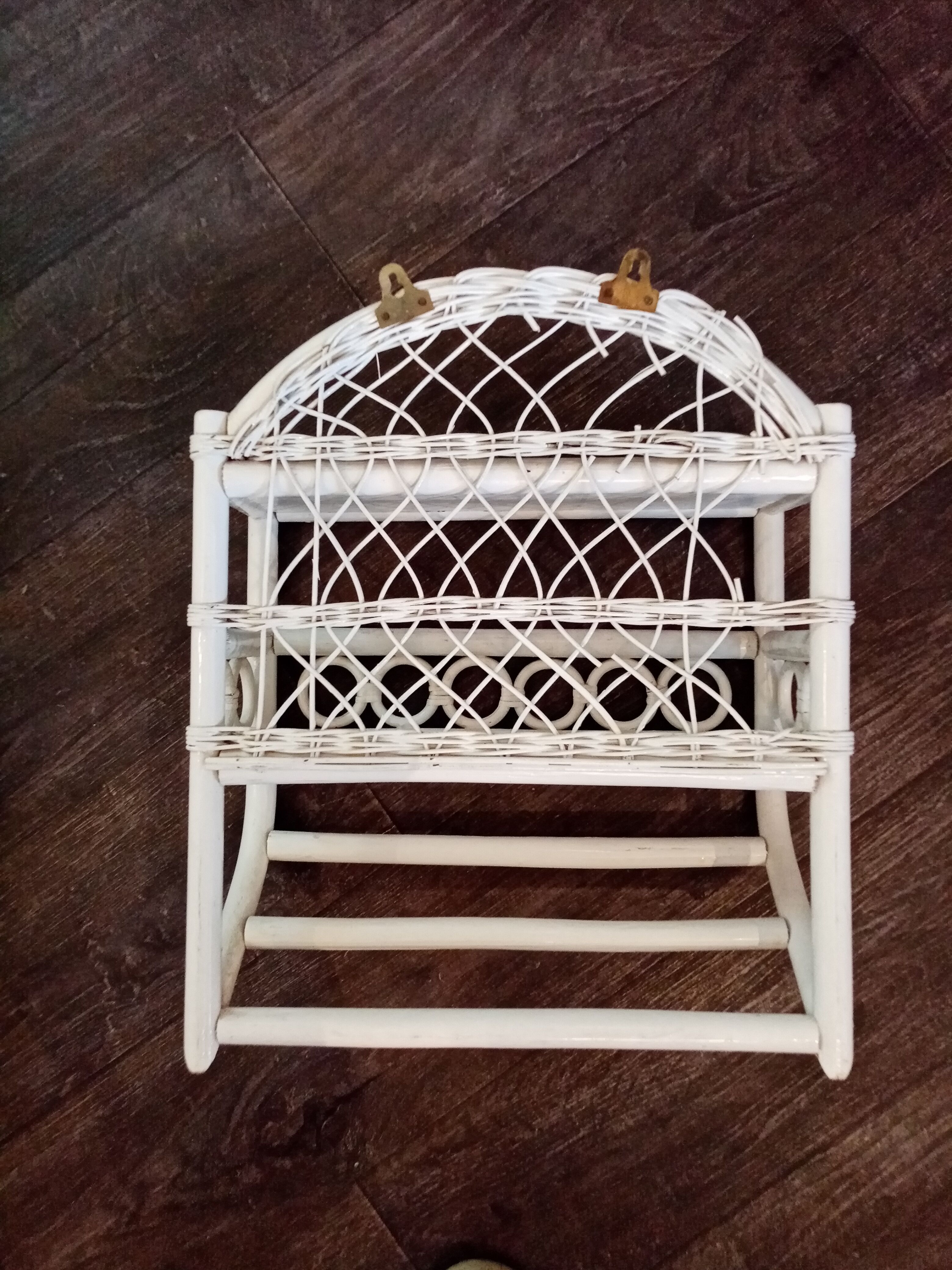 White rattan wall shelf