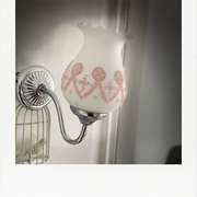 Chrome and opaline applique, touches of pink