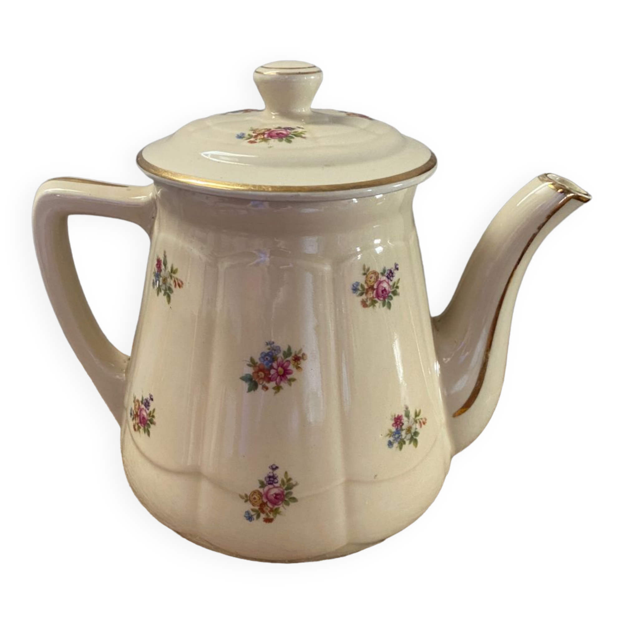 Old teapot or coffee maker in English style.