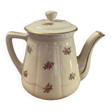 Old teapot or coffee maker in English style.