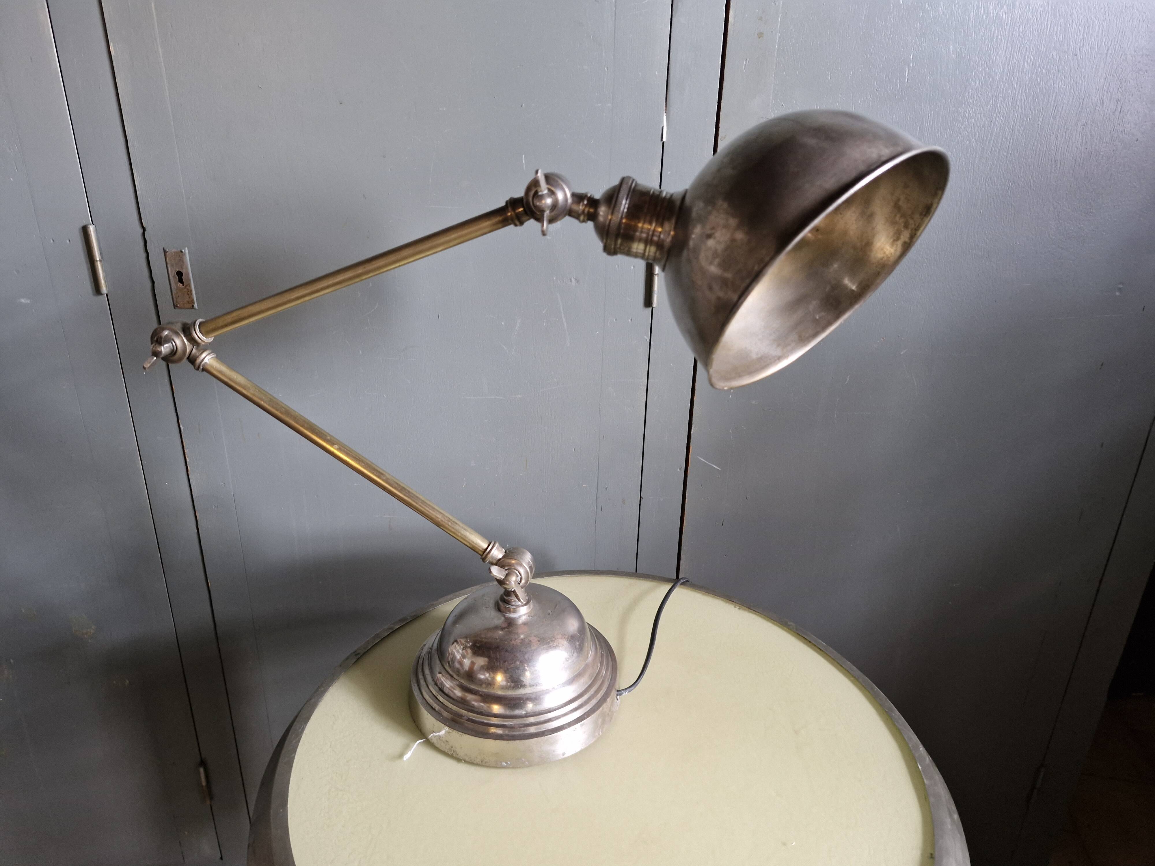 Old adjustable industrial lamp in bronze with 2 arms.