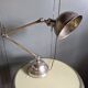 Old adjustable industrial lamp in bronze with 2 arms.