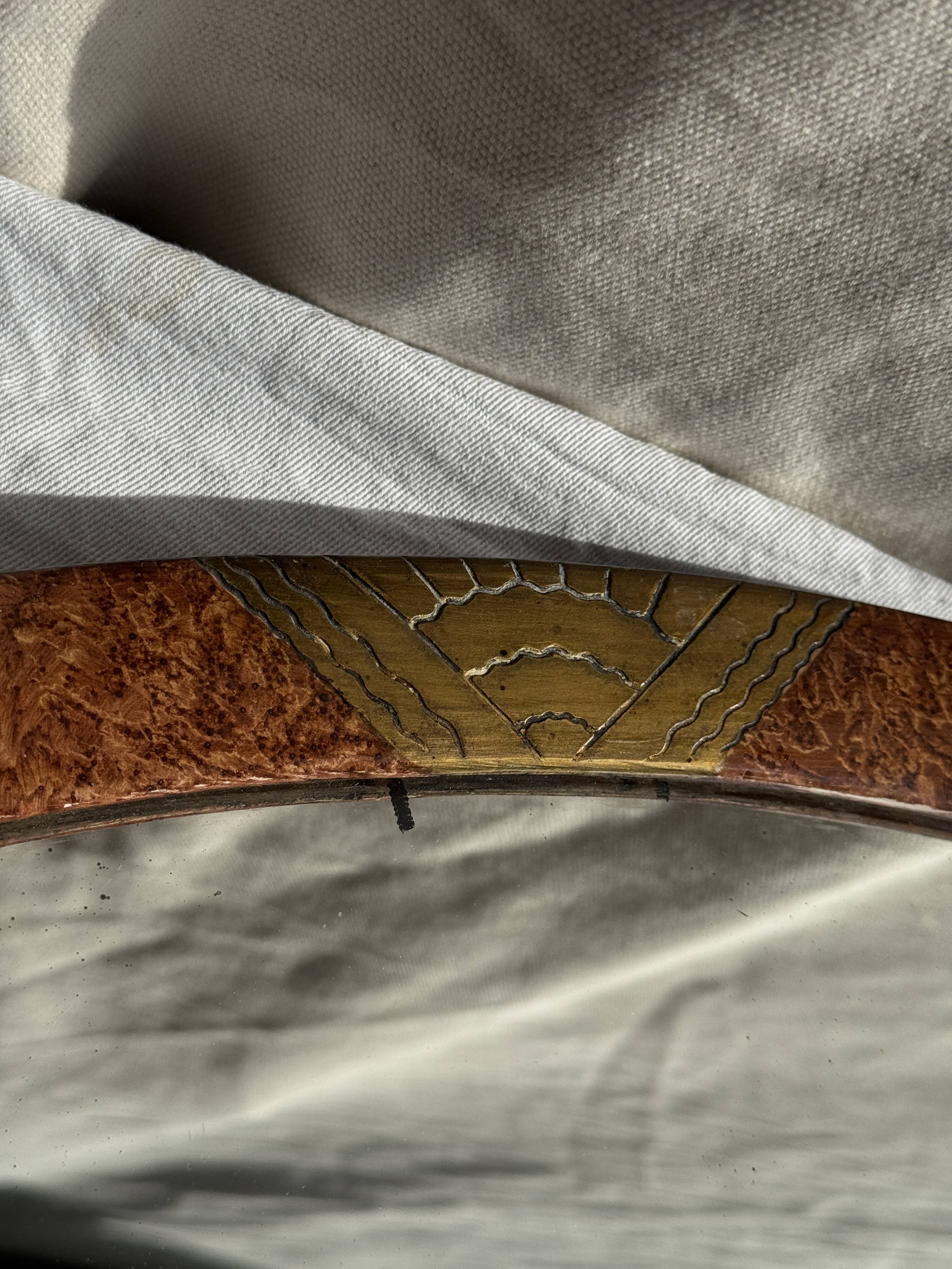 Small oval Art Deco mirror in brown and gold 33x54.