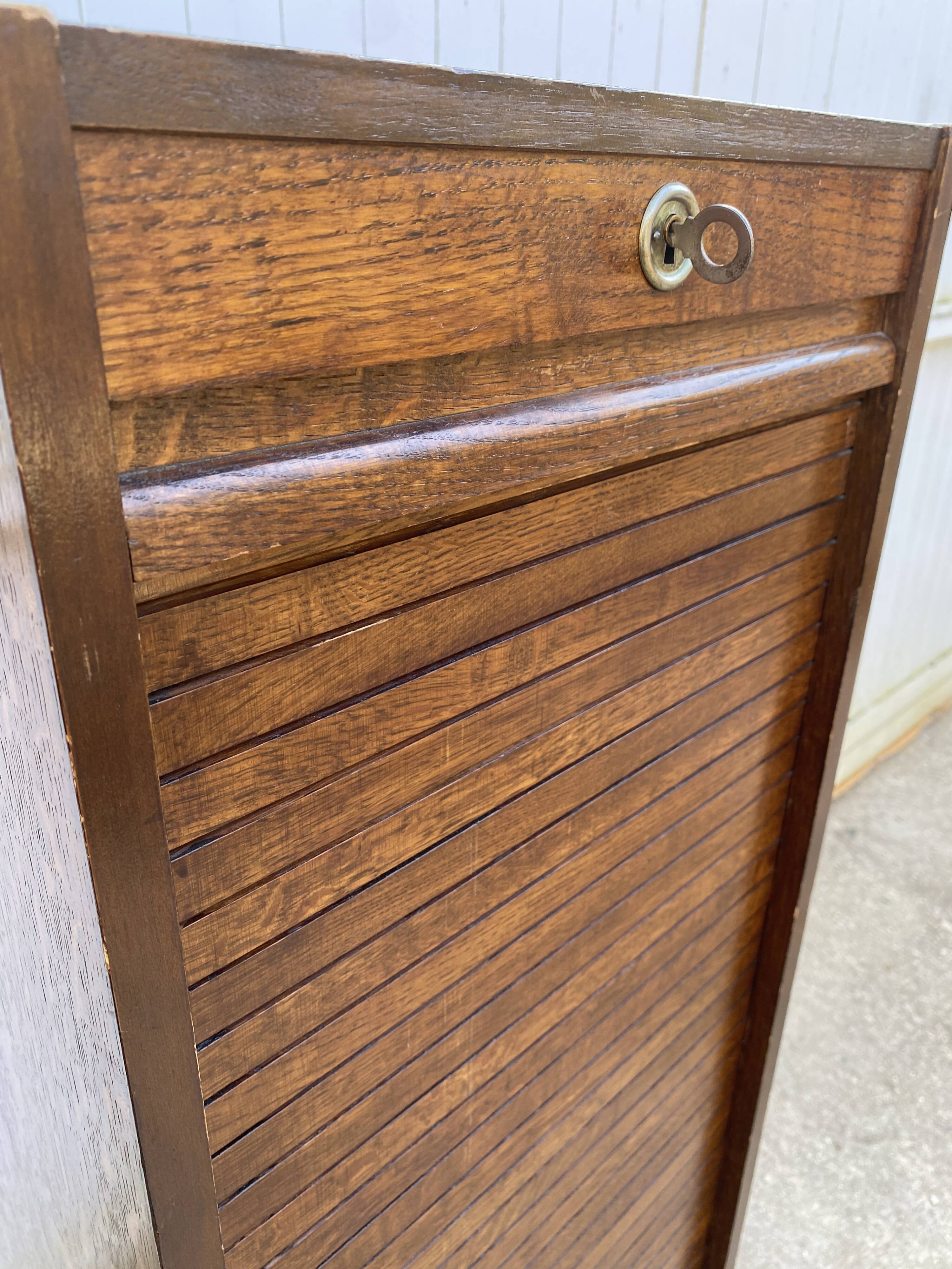 1970 oak office storage cabinet with curtains.