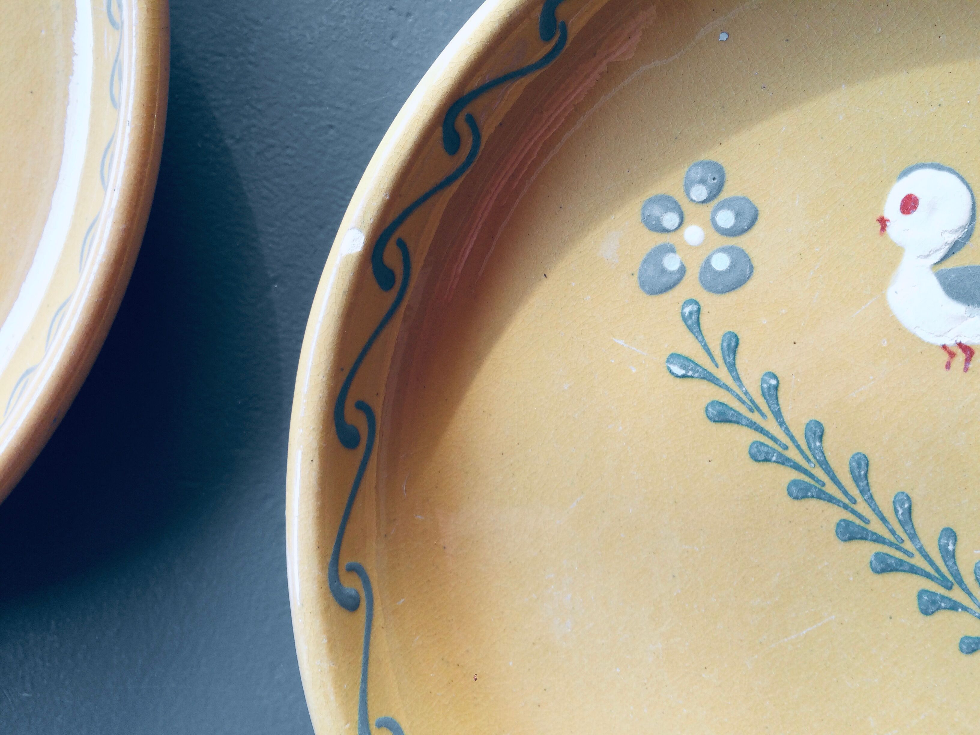 The six Piaf plates in painted terracotta