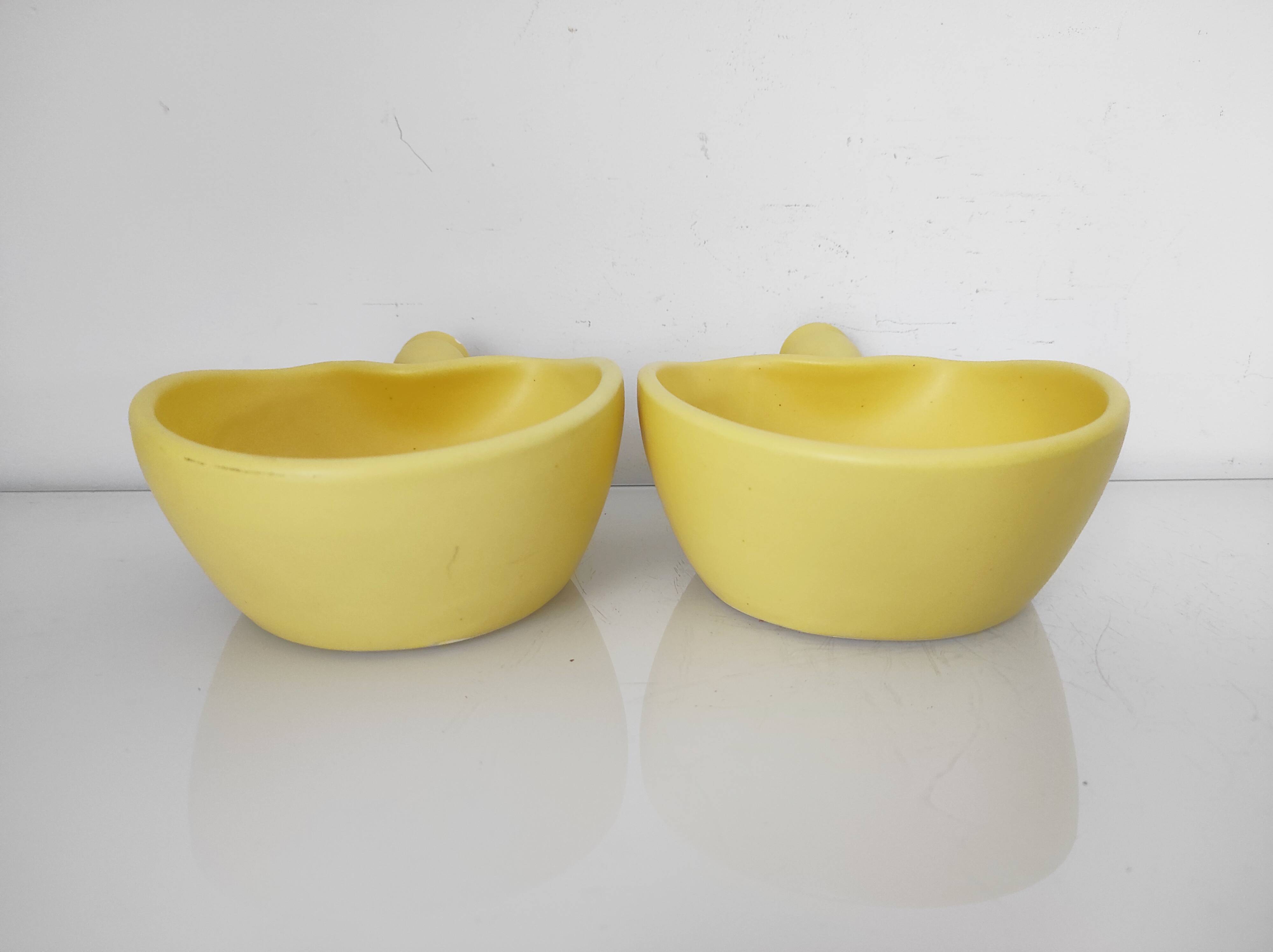 Two yellow ceramic dishes