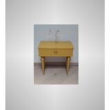 Old bedside table with compass feet