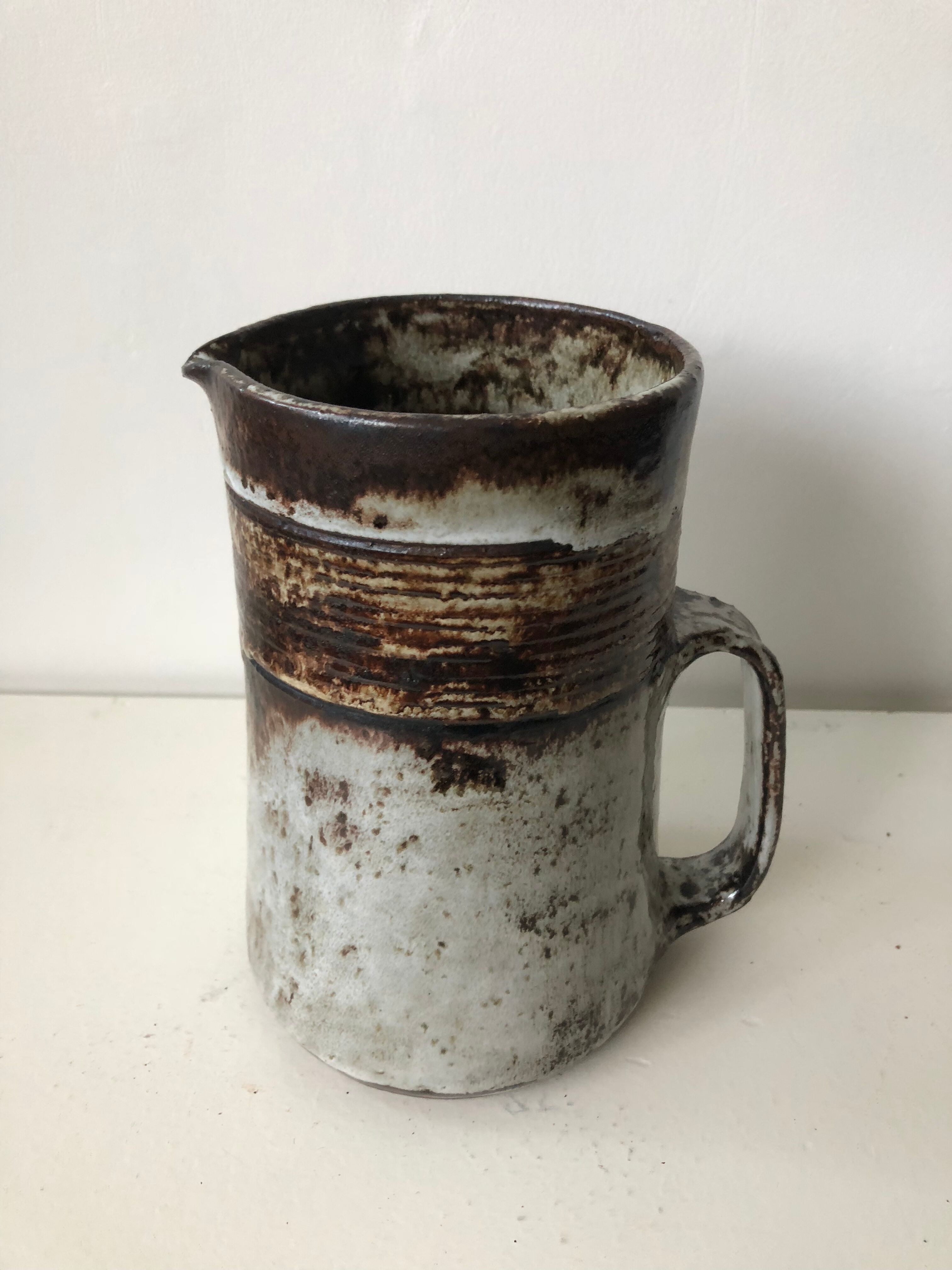 Brown grey enamelled stoneware pitcher