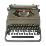Machine à écrire olivetti et sa valise rotin