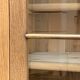 Parisian glass cabinet in solid raw oak, 1950