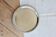 Vintage round metal plate with silver trim and beads.
