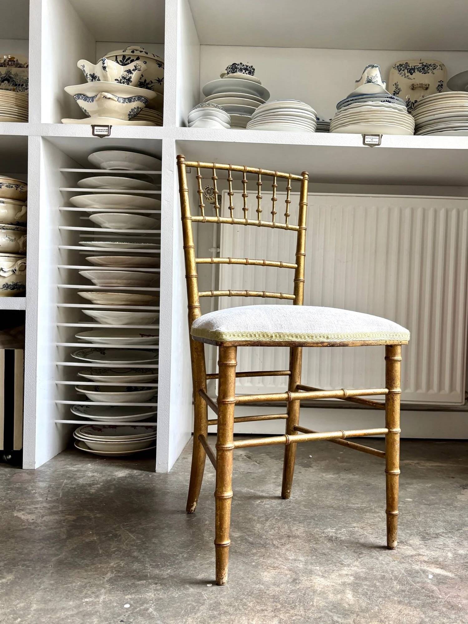 Napoleon III chair in gilded bamboo wood and beige cotton.