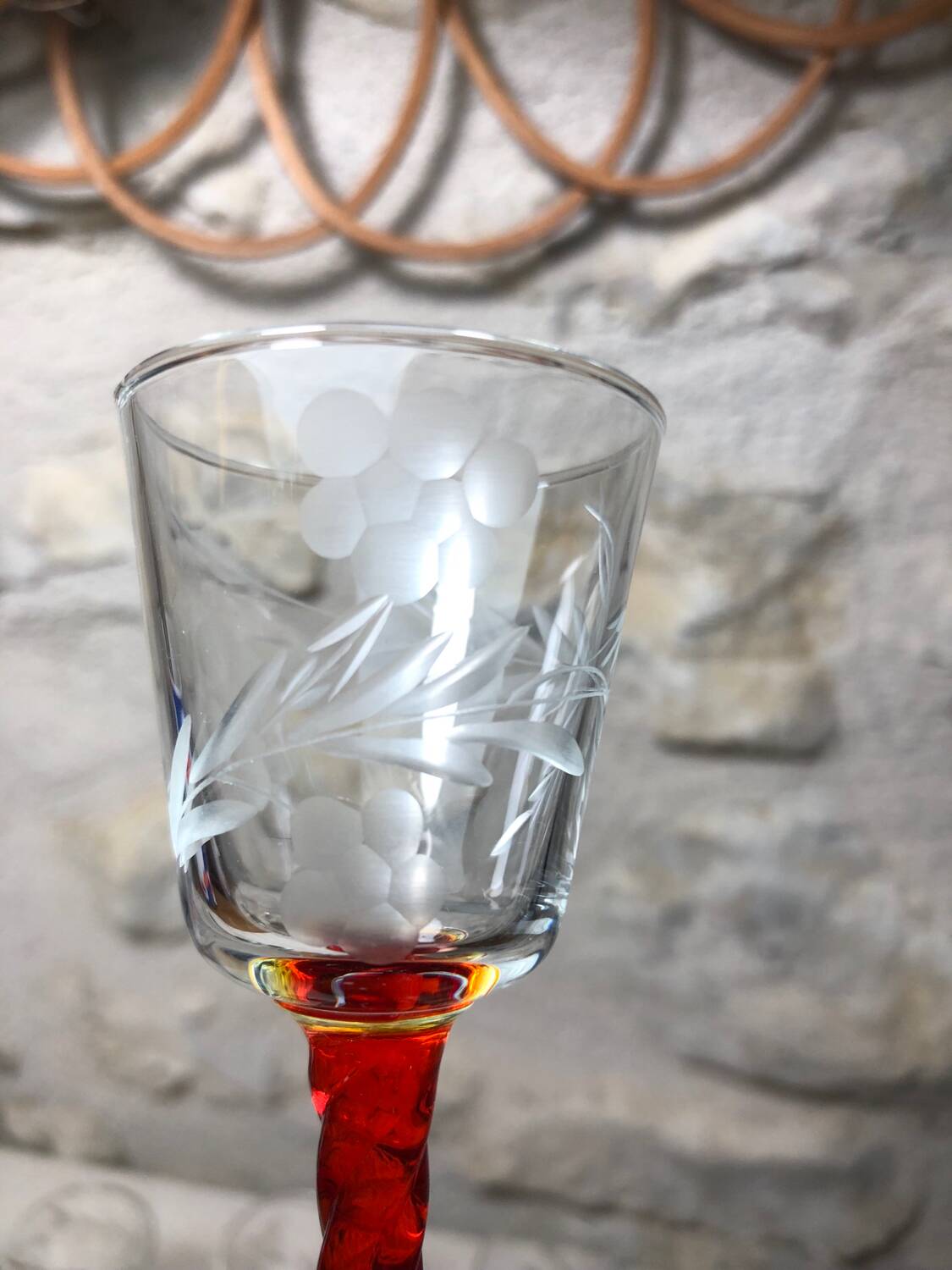 Antique and rare! Sold in a set of 12 colorful twisted stemmed glasses engraved with flowers and leaves