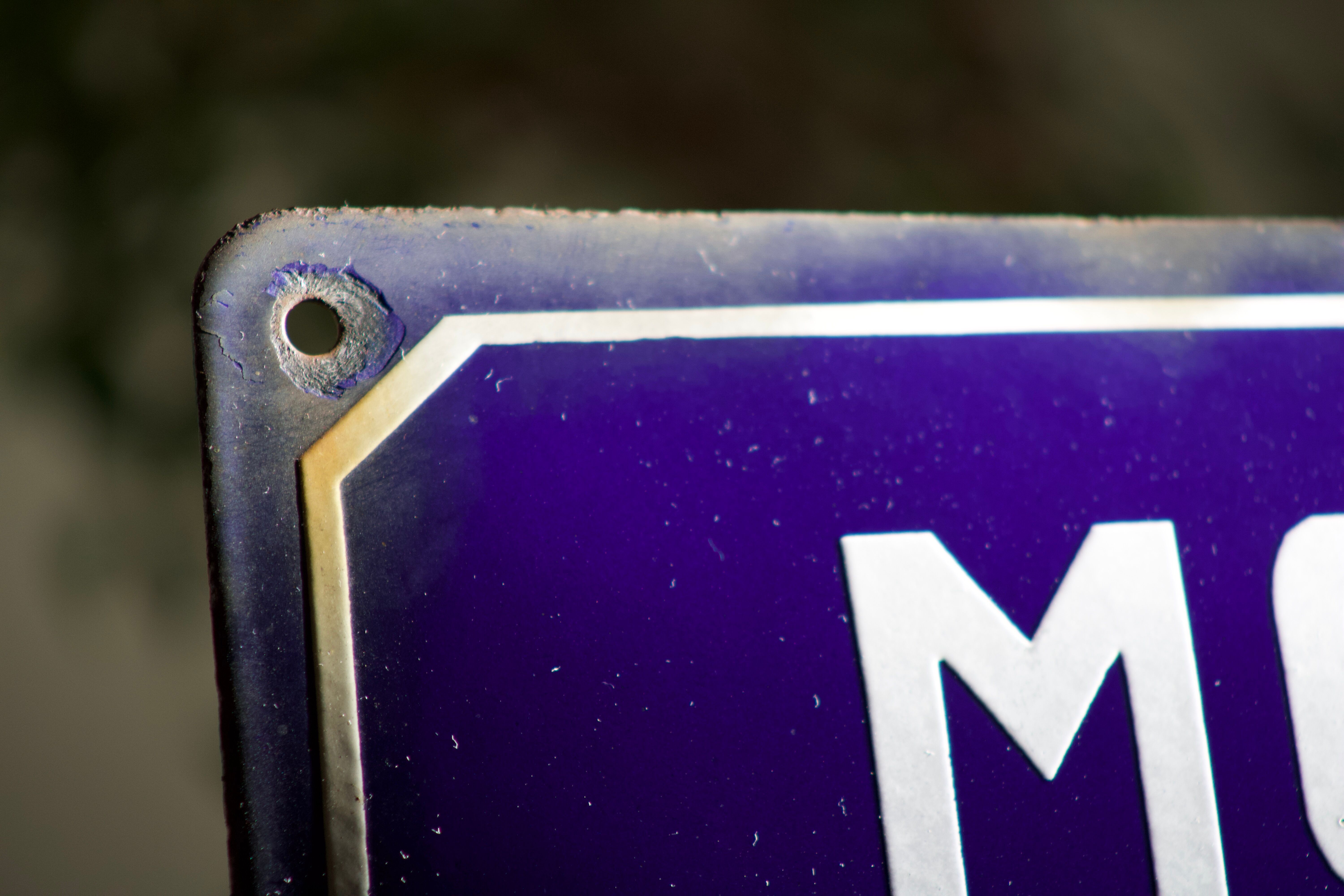 Former French street name plaque in bulging enamel led sheet "Montée des Tupinieres"