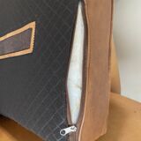 Brown leather club armchairs with an antique finish.