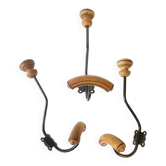 Trio of antique wooden and metal coat hooks