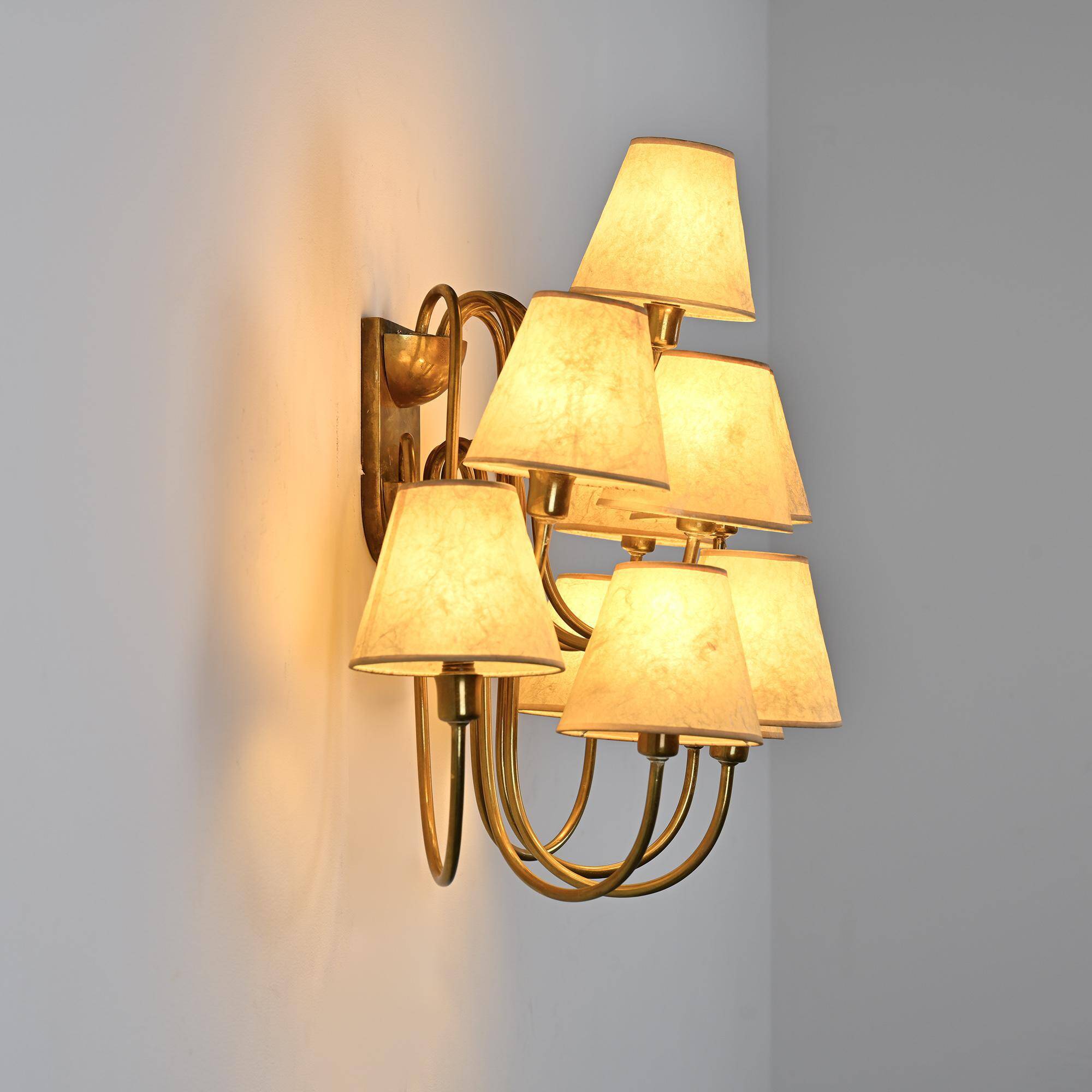 Wall sconce with nine arms in brass, France, circa 1950.