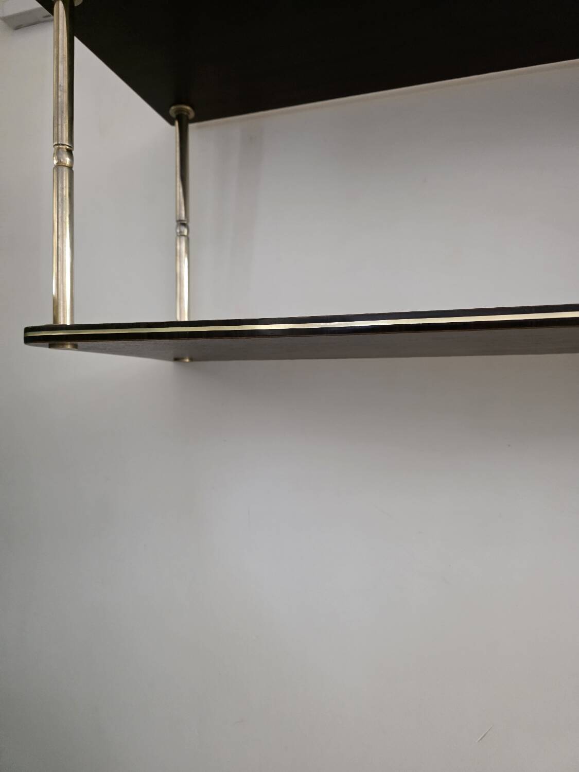 Wooden shelf with gold metal