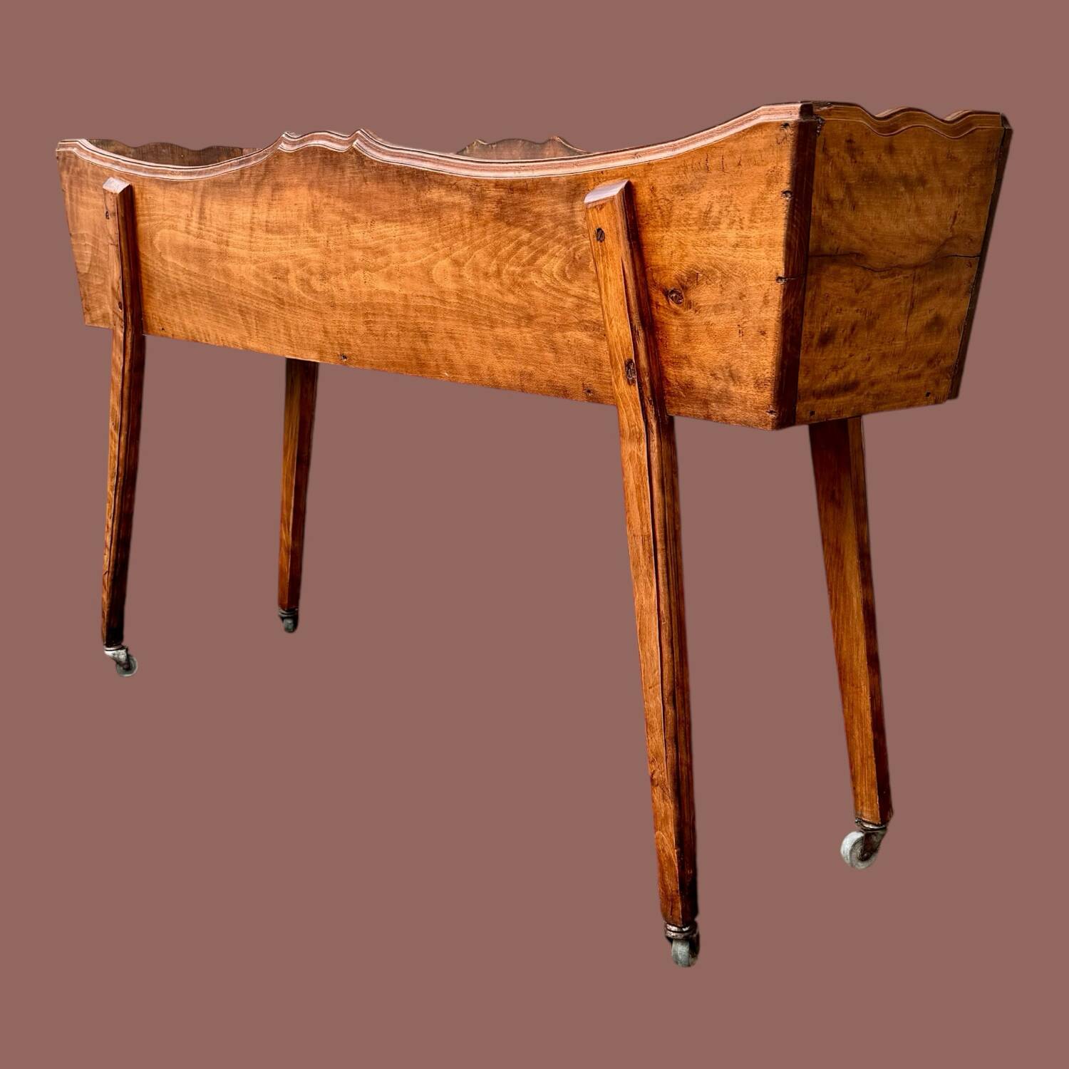 Old indoor planter on wheels