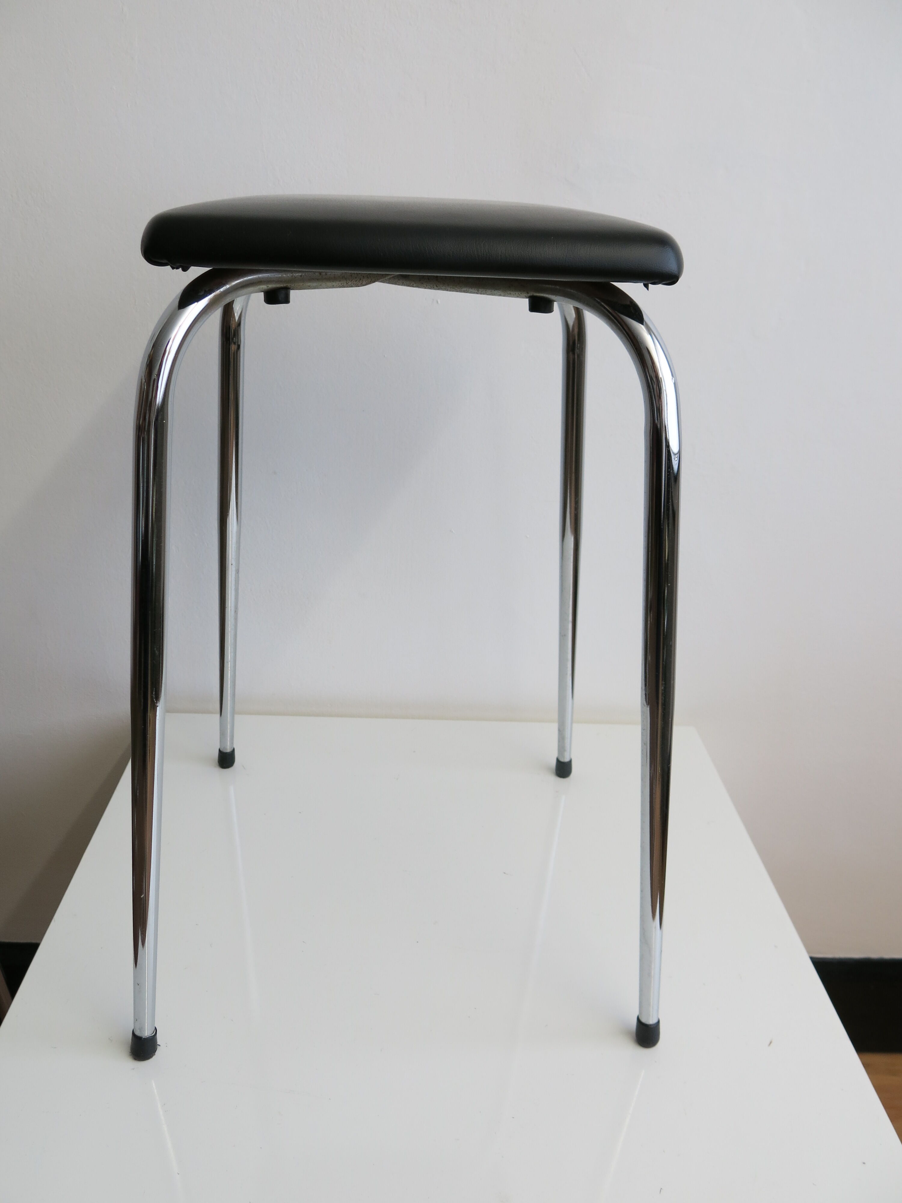 Vintage stool in chrome metal and black skai