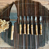 6 bamboo forks and a pie server