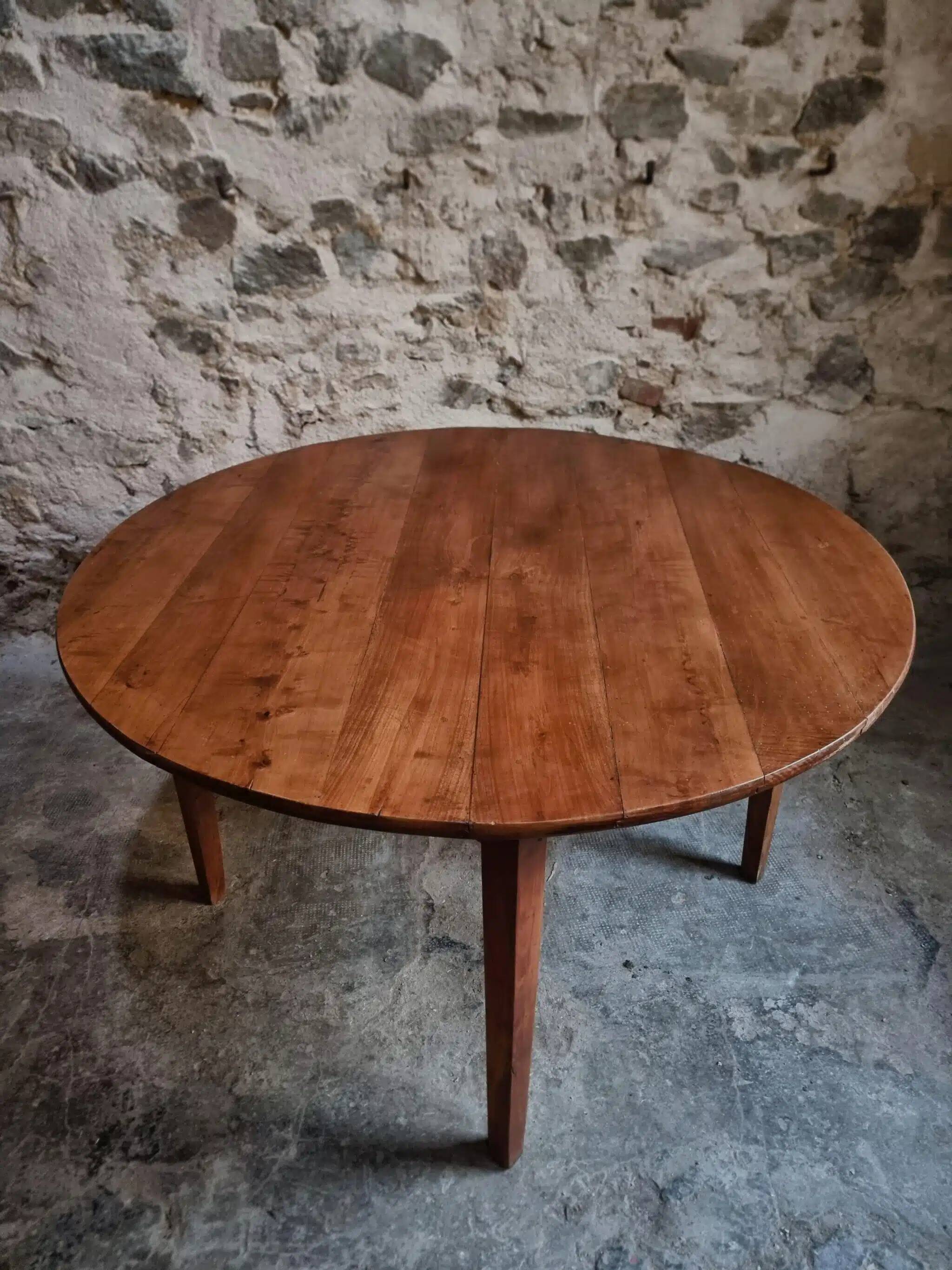 Antique round dining table in cherry wood, France, circa 1920.