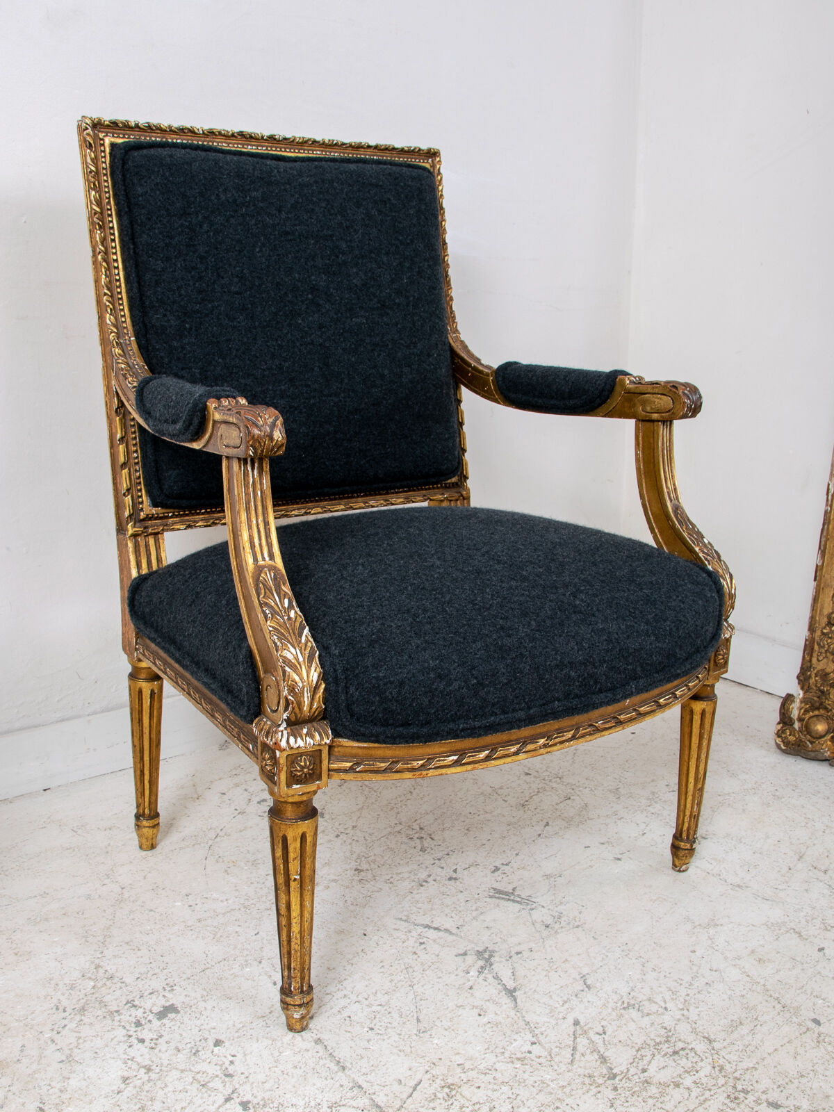 Pair of 19th century Louis XVI gilt armchairs newly re upholstered in holland and sherry fabric