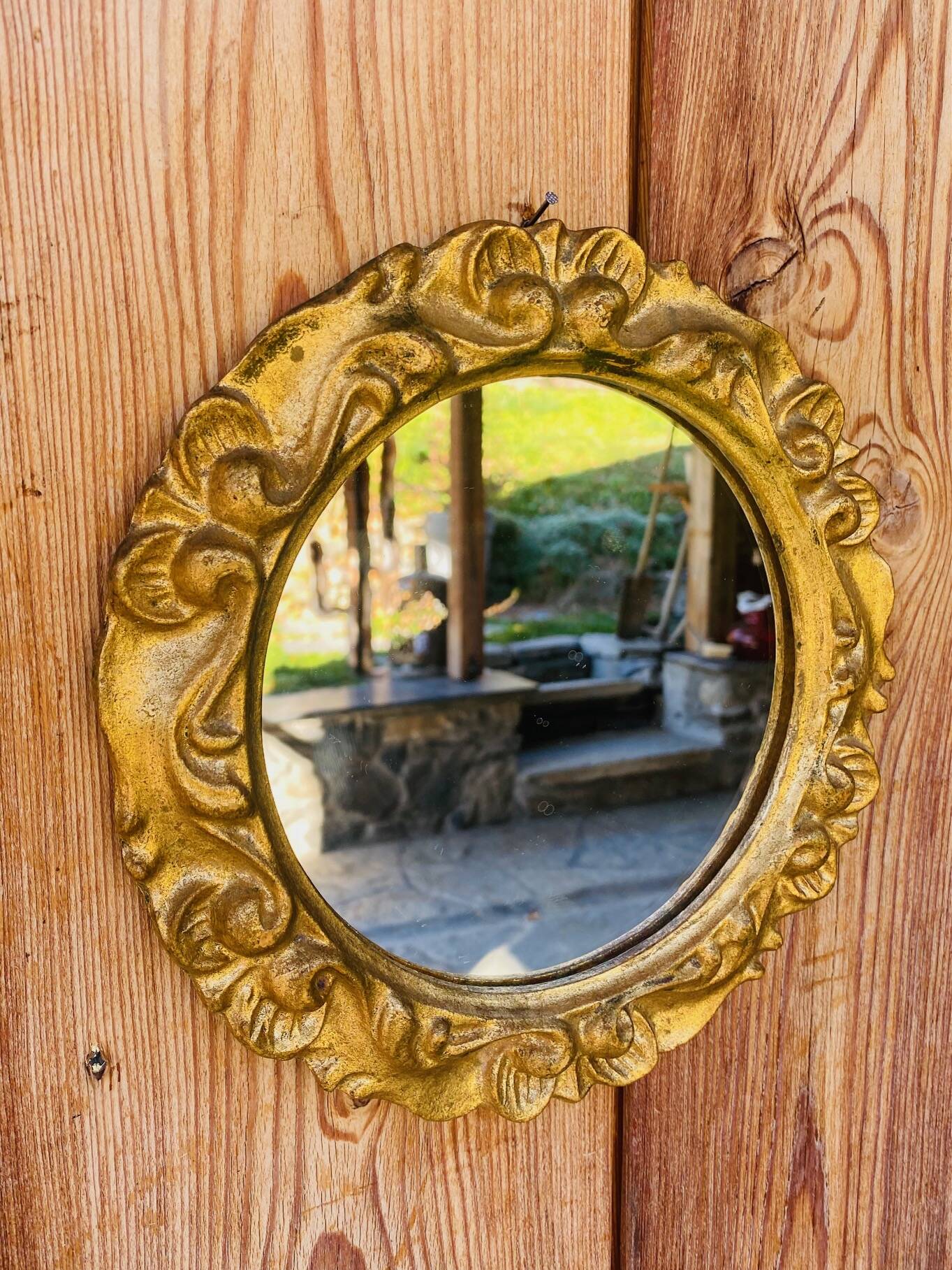 Small round antique gold mirror