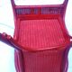 Fauteuil vintage en rotin rouge