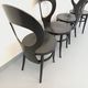 Set of 4 vintage Mouette chairs by Baumann in black wood from the 1960s.