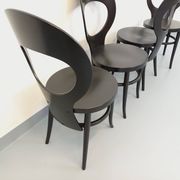 Set of 4 vintage Mouette chairs by Baumann in black wood from the 1960s.