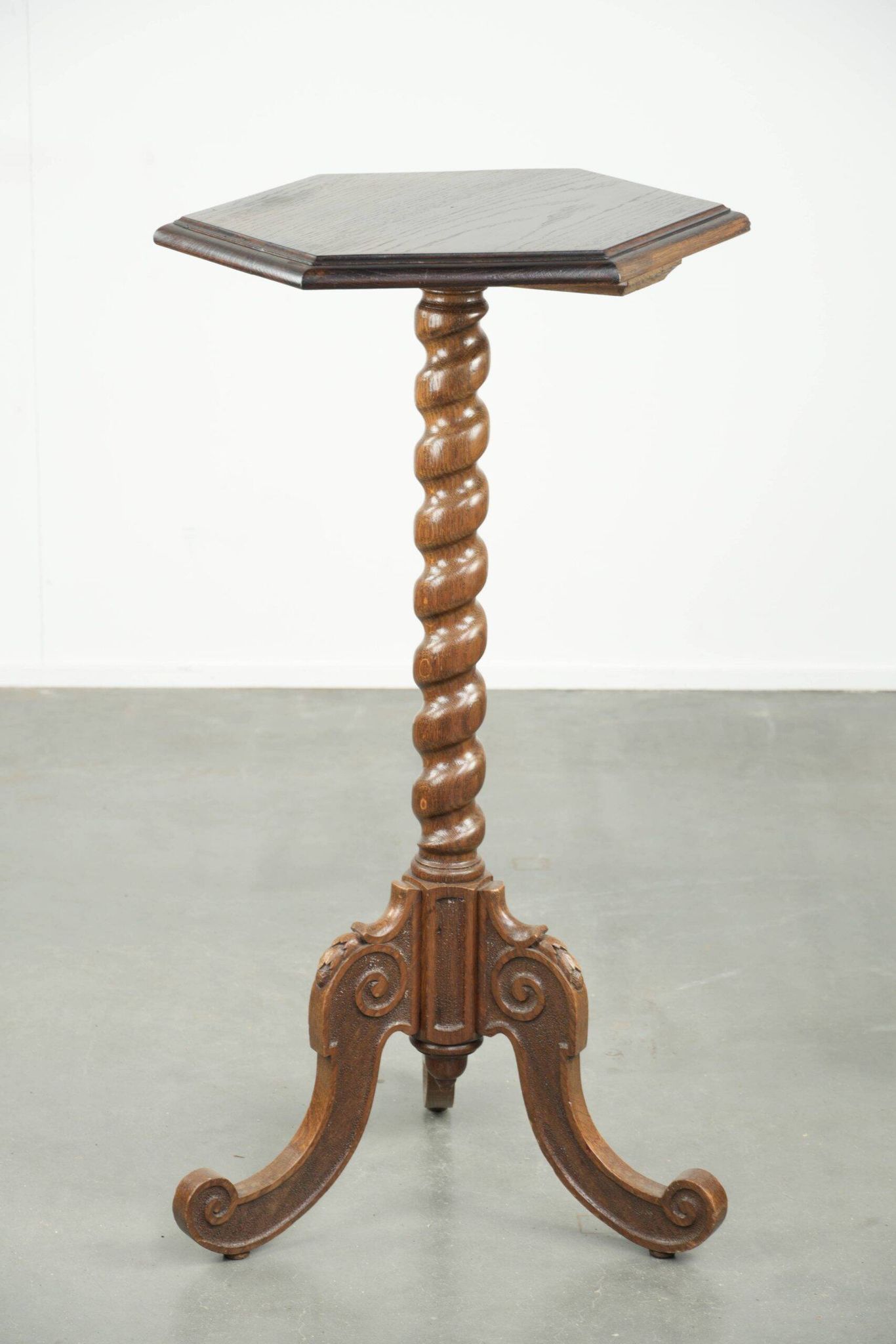 Antique tall oak plant/side table with wood carving and a turned leg