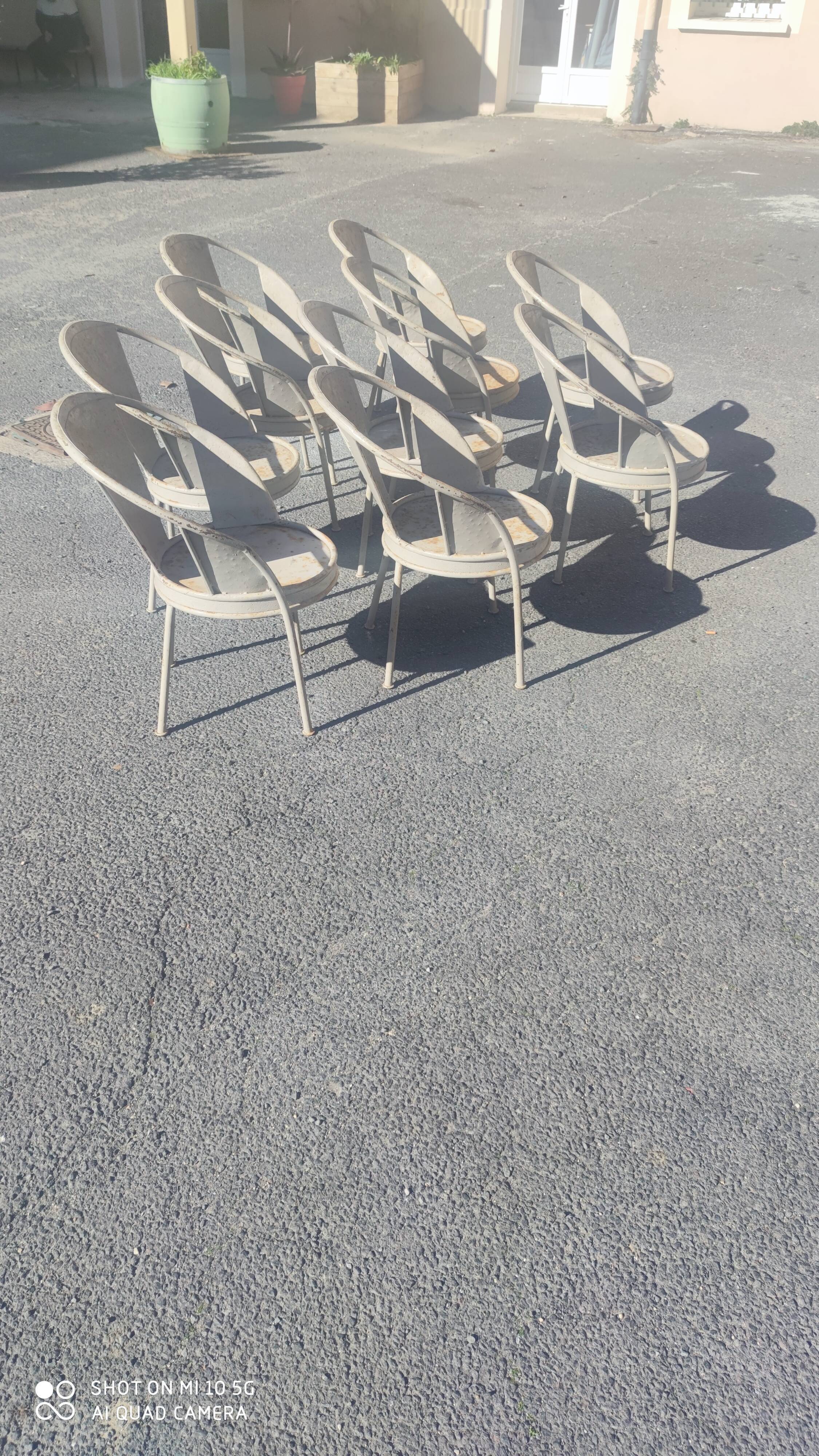 Series of 10 garden chairs made of steel garden patina