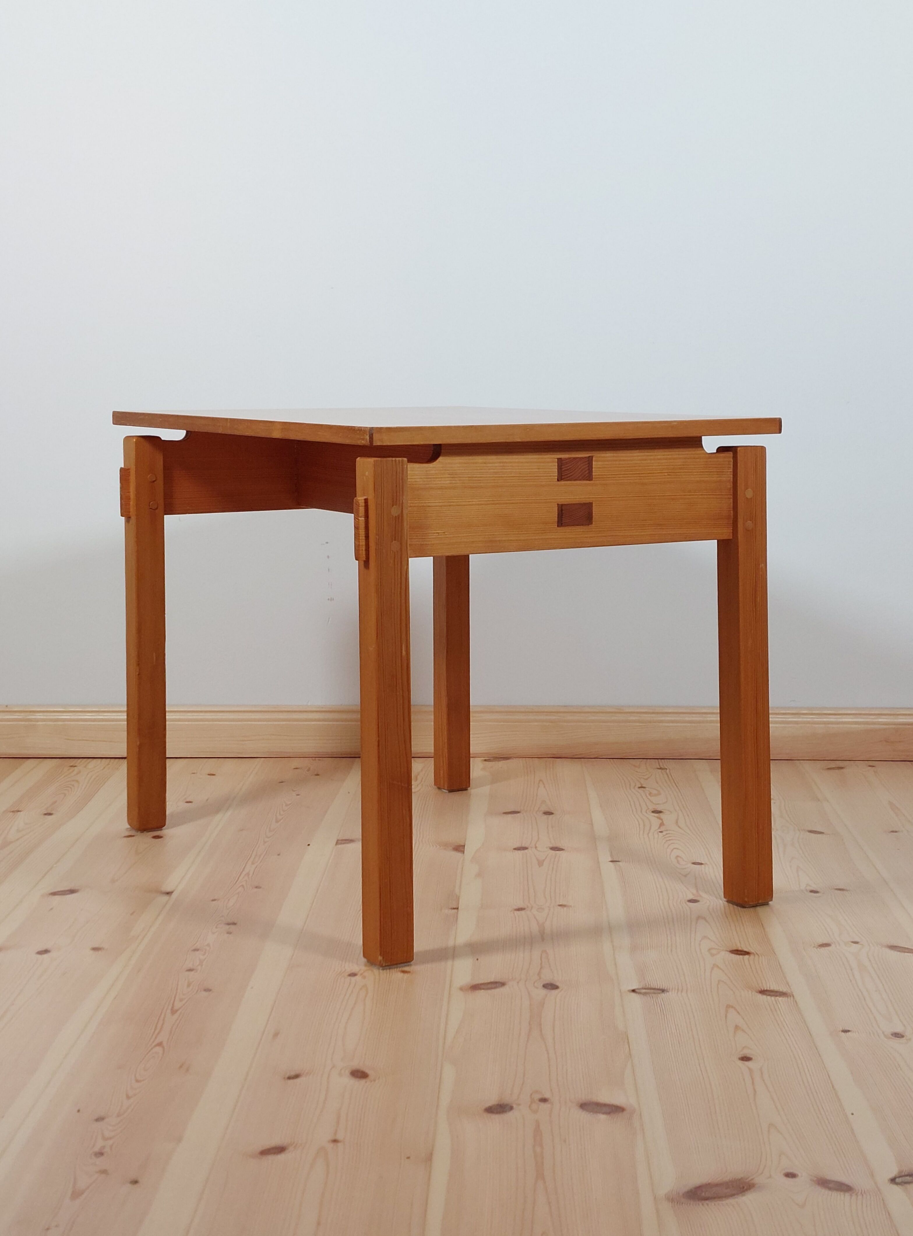 Meticulously crafted vintage pine side table, a masterpiece.