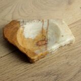 Empty pocket in orange and white marble ashtray