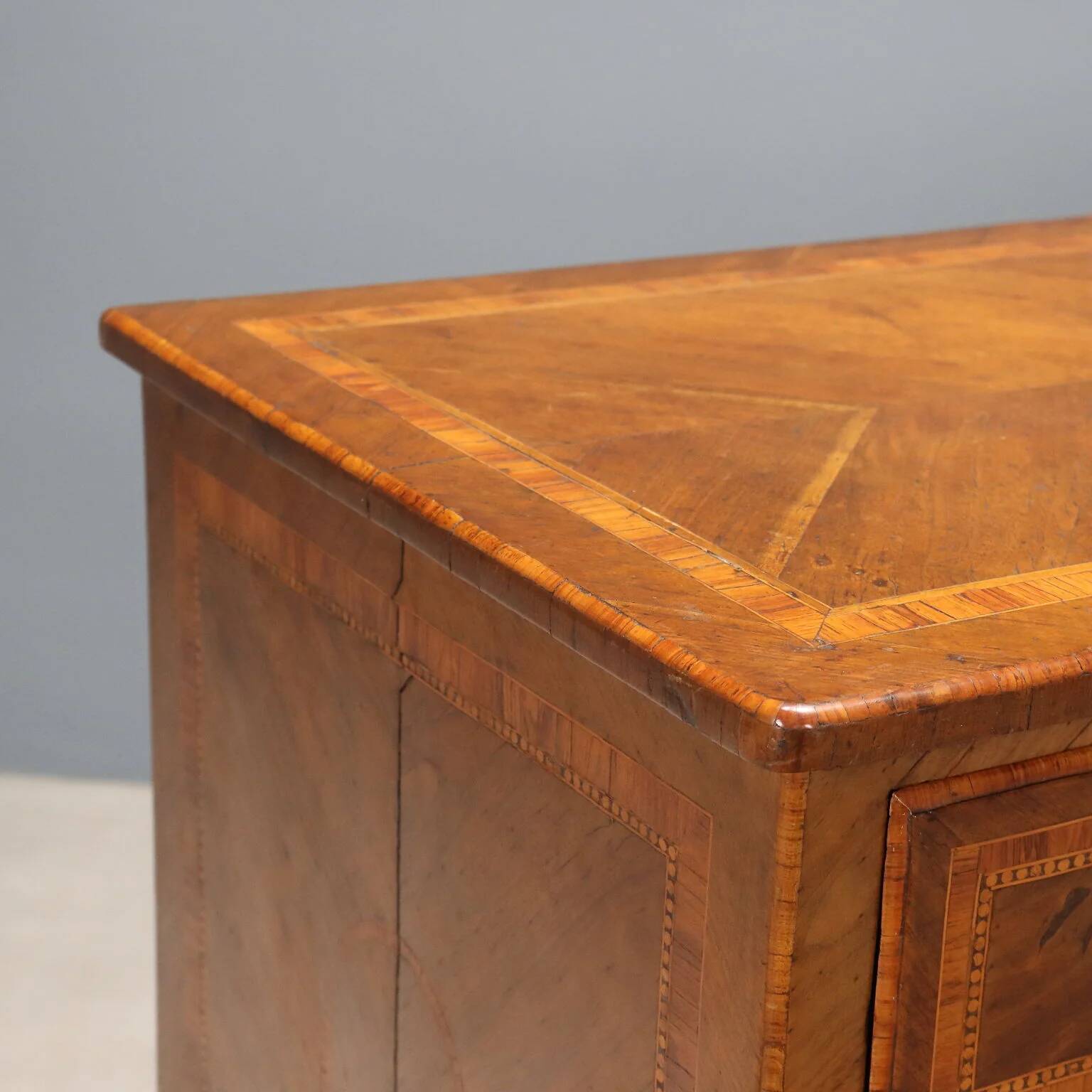 Antique neoclassical walnut commode from the 18th century.