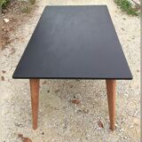 Table de salle à manger à pieds compas