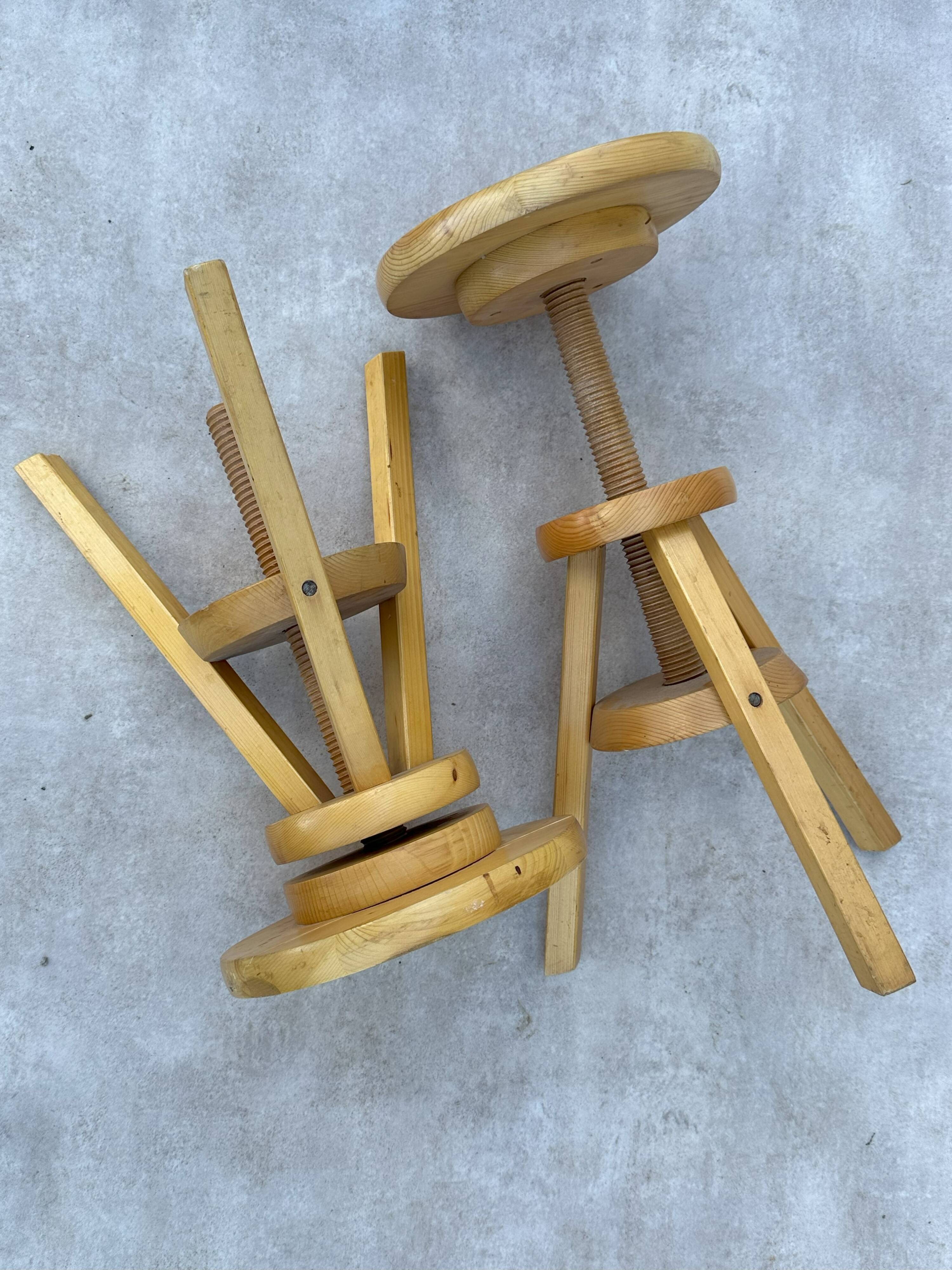 2 wooden screw stools