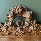 Golden trumeau mirror for fireplace, late 19th century, with sculpted pediment.