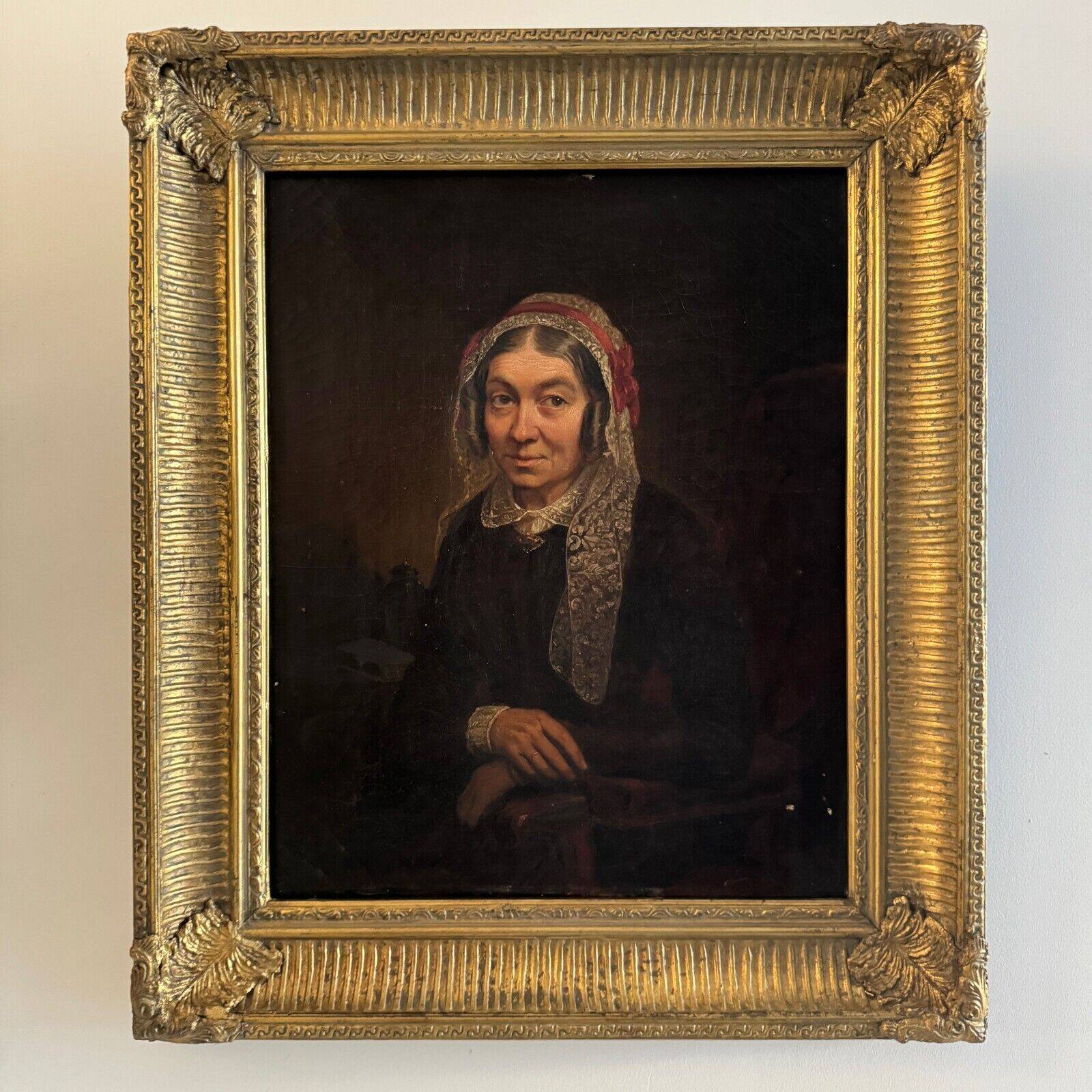 Late 19th century portrait representing a woman with a headdress and lace