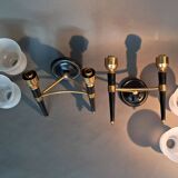 Pair of two-light torchiere wall lights in black lacquered metal and gilded brass, Circa 1960.