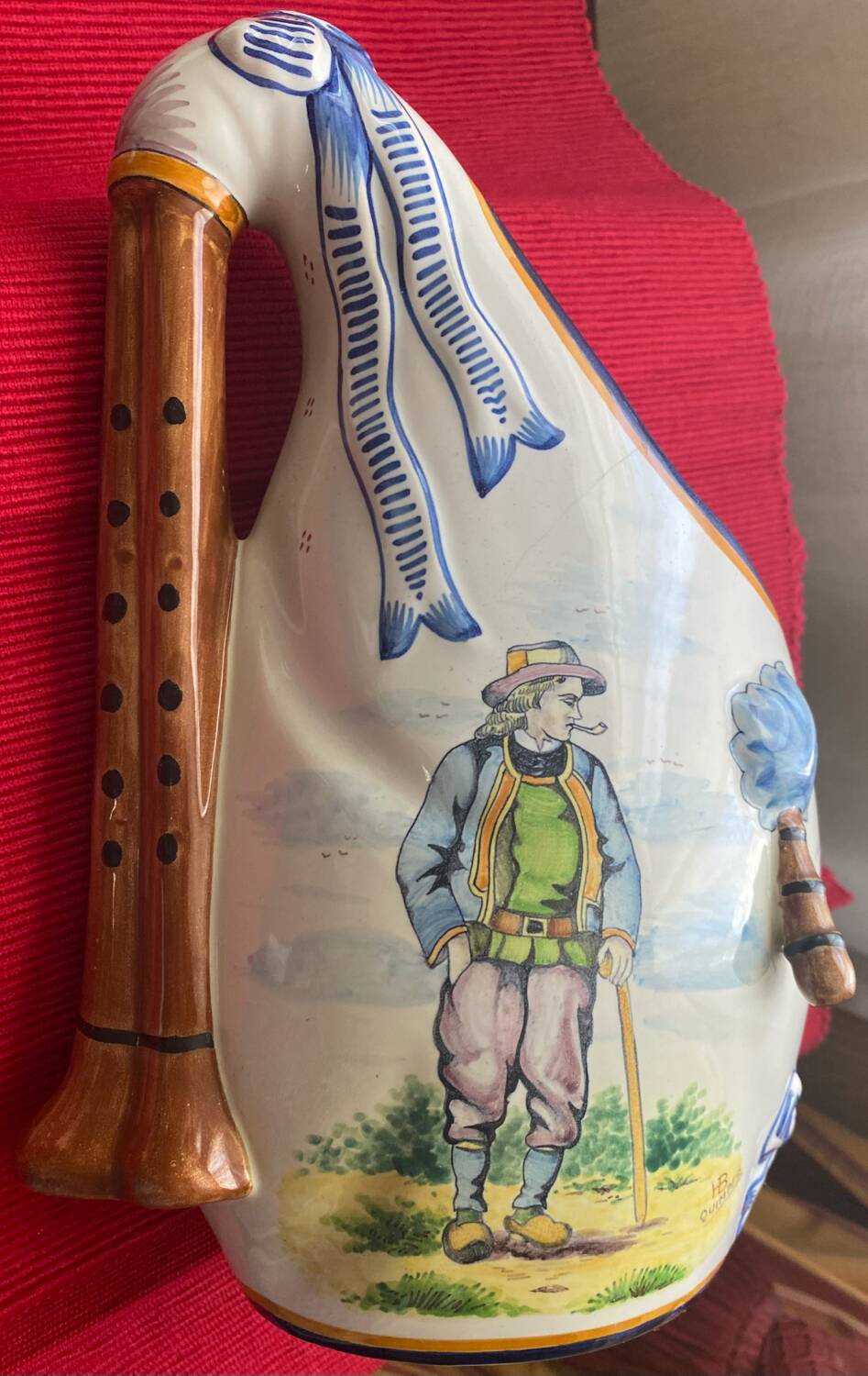 Quimper vase in the shape of a bagpipe, signed and numbered.