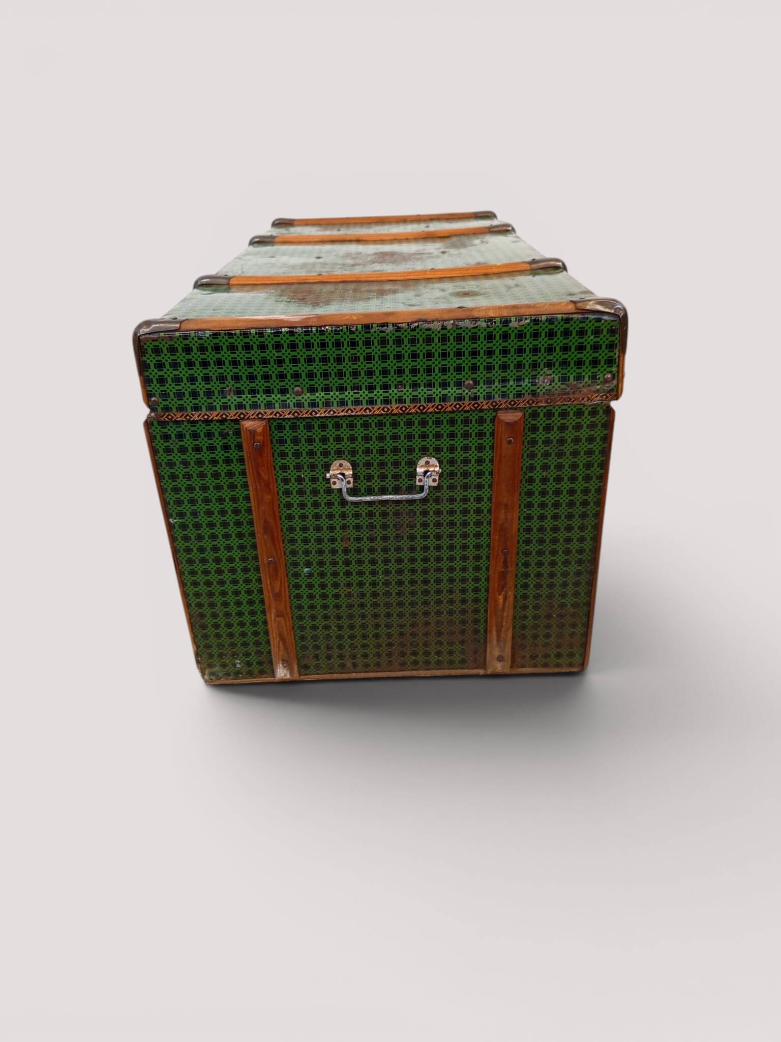 Vintage wooden and metal green travel trunk, circa 1930.