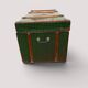 Vintage wooden and metal green travel trunk, circa 1930.