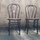 Two pairs of black 50s chairs - number 18 - cannée