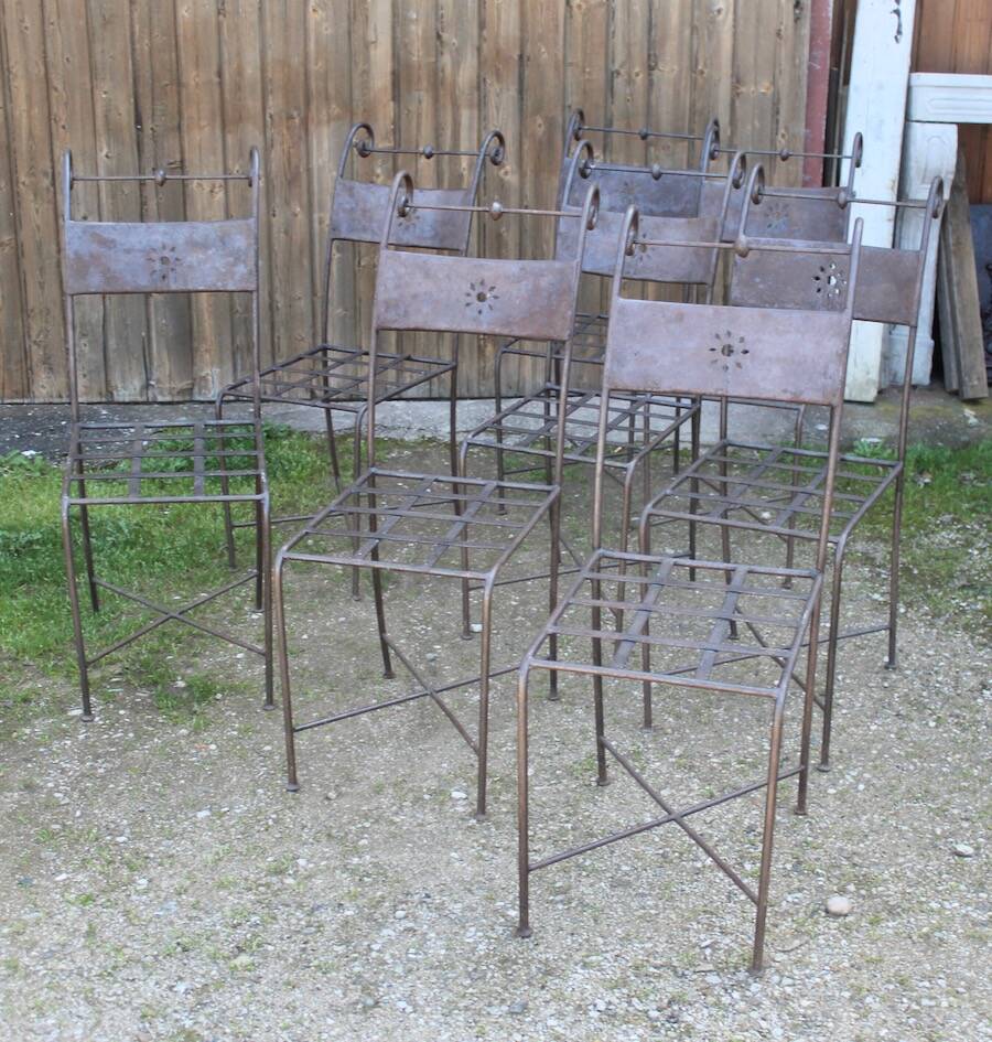Series of 8 wrought iron garden chairs