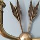 Vintage wall lamp decorated with bronze arrows