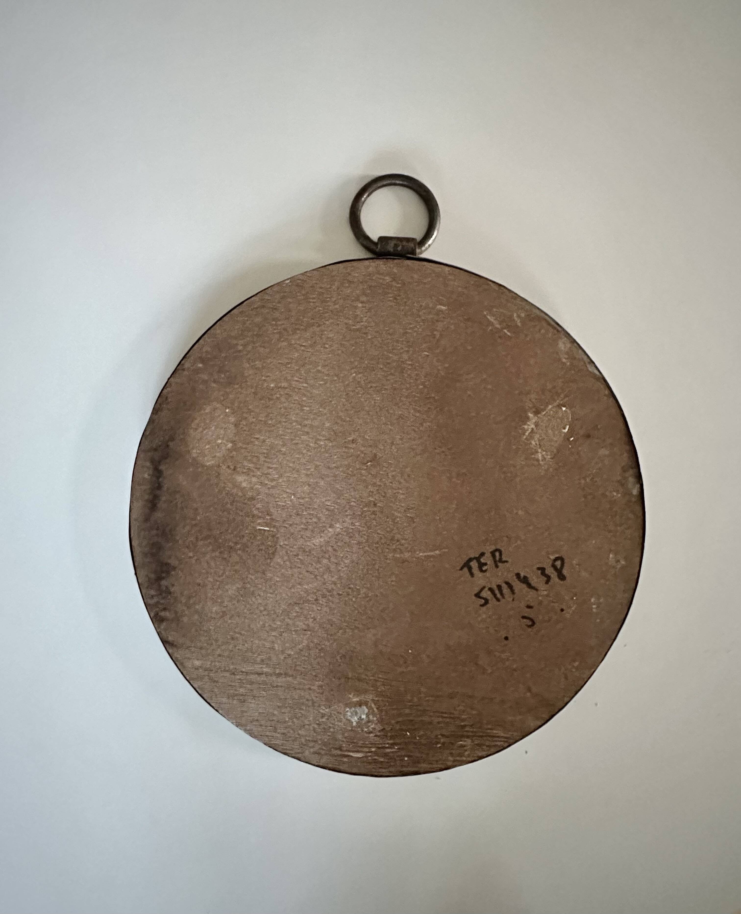 Miroir mural rond brutaliste des années 1950.