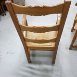 Two oak armchairs with straw seats